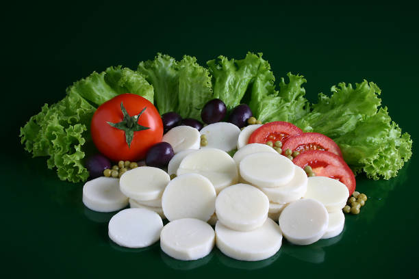 fresh salad tomatoes, olives, green leaves and palm hearts'n fresh salad tomatoes, olives, green leaves and palm hearts'n. palm heart photos stock pictures, royalty-free photos & images