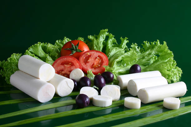 heart of palm salad, tomatoes, olives and green leaves heart of palm salad, tomatoes, olives and green leaves. palm heart photos stock pictures, royalty-free photos & images