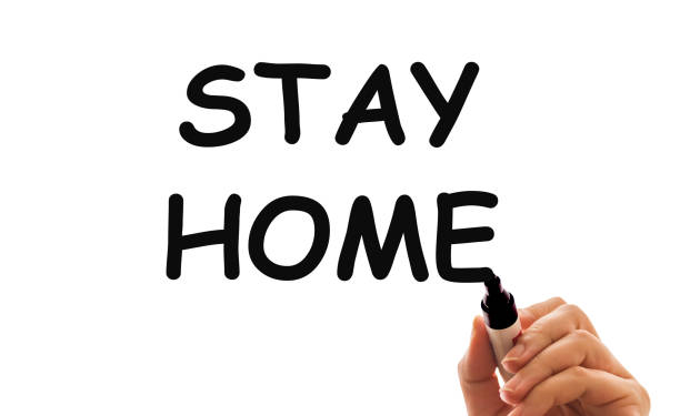 istock Inscription stay at home. Outbreak Warning. written white chalk on blackboard in connection with epidemic of coronavirus worldwide 1218262835