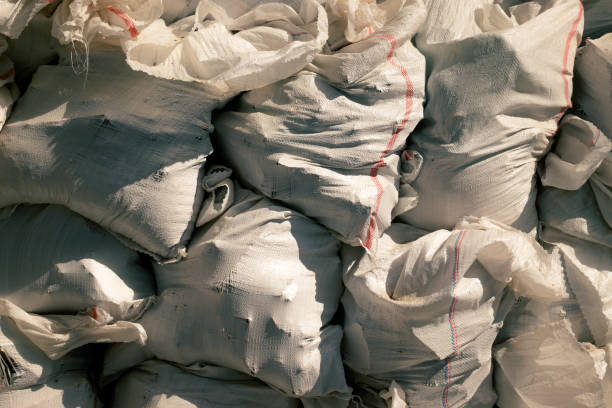istock White construction garbage bags. Construction garbage bags piled on top of one another. A large pile of construction garbage bags. abstract background 1218262961