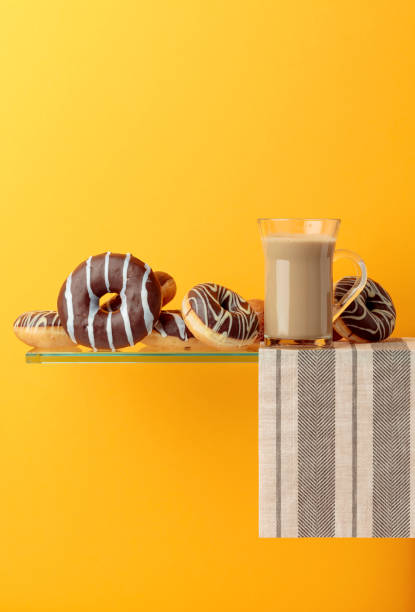 istock Chocolate donuts and latte on a black background. 1218264919