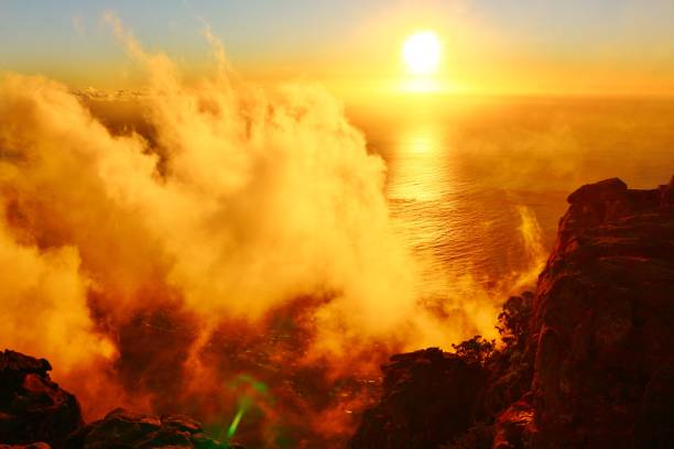 Magic Sunset in the clouds over the ocean Magic Sunset in the clouds over the Atlantic ocean. Photo taken from Table Mountain near Cape Town in South Africa. table mountain and the tablecloth stock pictures, royalty-free photos & images