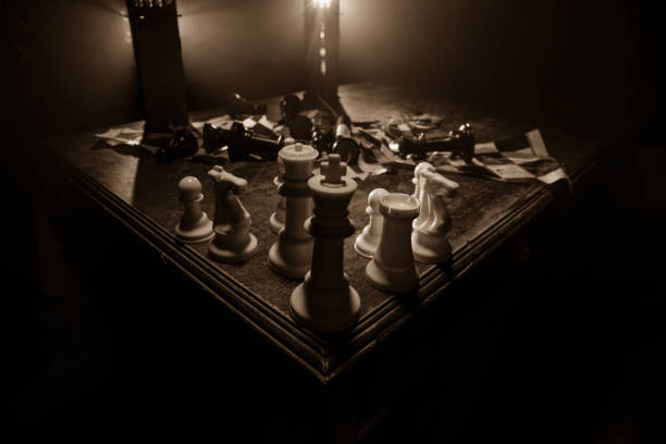 istock Chess figures on a dark background with smoke and fog. Selective focus 1218268478