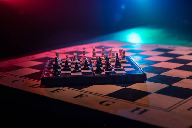 istock Chess figures on a dark background with smoke and fog. Selective focus 1218268483