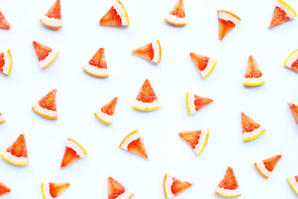 High vitamin C. Juicy grapefruit slices on white.