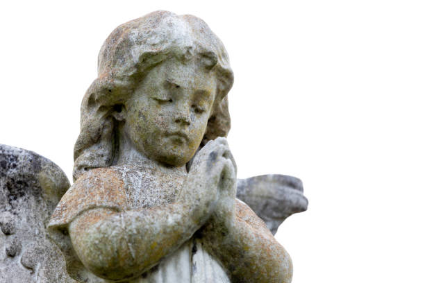 istock Angel, old statue of praying little angle, white  background with copy space 1218273761