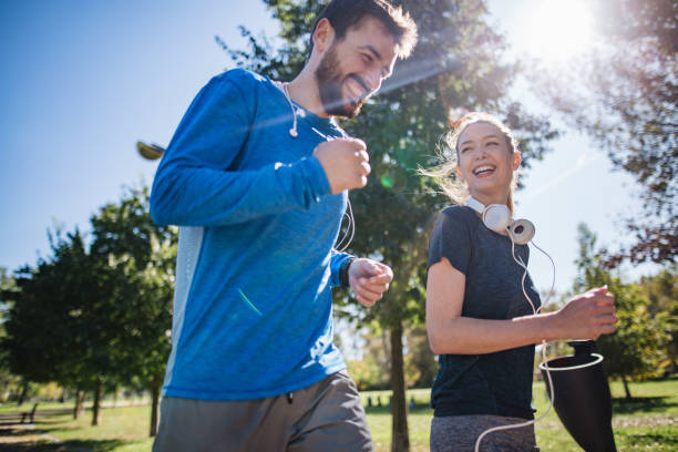 Cheerful couple having fun running together