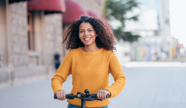 istock Young woman with an e-scooter 1218274570