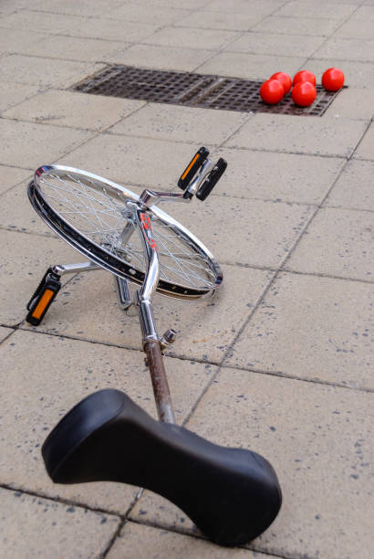 istock A unicycle and juggling balls lie on a footpath during a street performance 1218274776