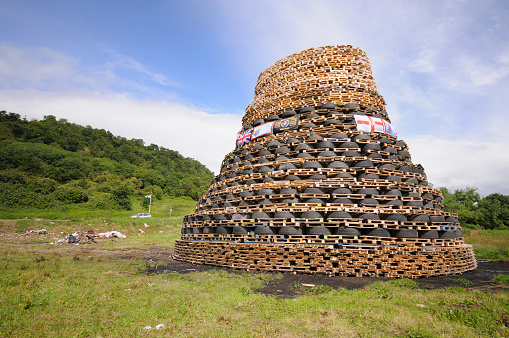 Bonfire at made from wooden shipping pallets to celebrate the 12th July commemoration of the Battle of the Boyne, (1690), Northern Ireland.