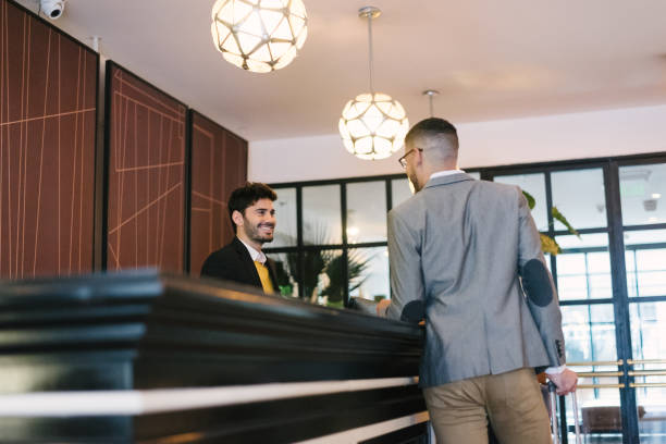 istock Businessman at hotel reception 1218278128