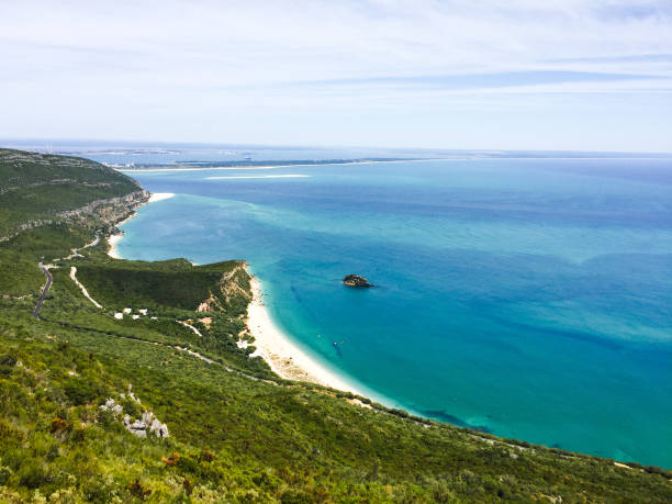lanscaped beach Hill view in Portugal Beautiful landscaped photography taken on the top of the Arrábida, mountain showing the hills, beach and nature around. A beautiful nature contrast in Portugal. setúbal city portugal stock pictures, royalty-free photos & images