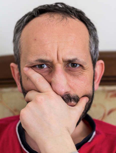 istock neglected man thinking at the  his home 1218282626