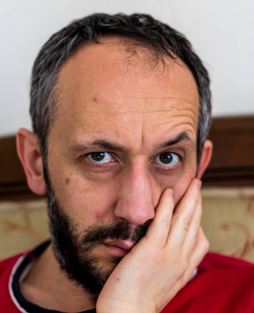 istock neglected man thinking at the  his home 1218282661