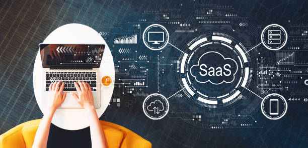 saas - software as a service concept with person using a laptop - iaas imagens e fotografias de stock