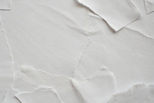 istock Blank white torn damaged paper poster texture background 1218283665