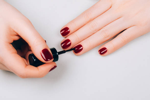 istock Woman making self manicure 1218283727