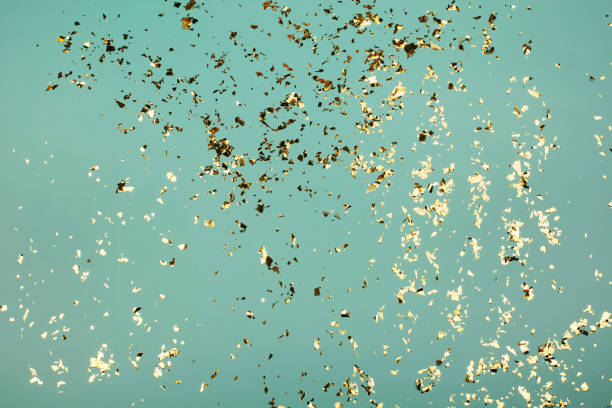 istock Golden flying sparkles on blue holiday background. 1218283788