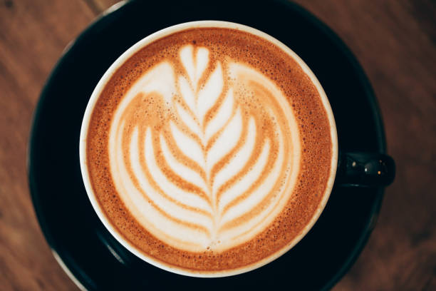 istock Red cup of cappucino with beautiful latte art 1218284891