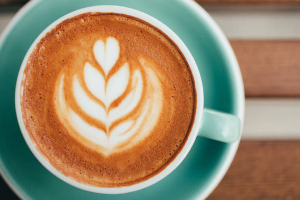 Cup of cappuccino with beautiful foam, overview.