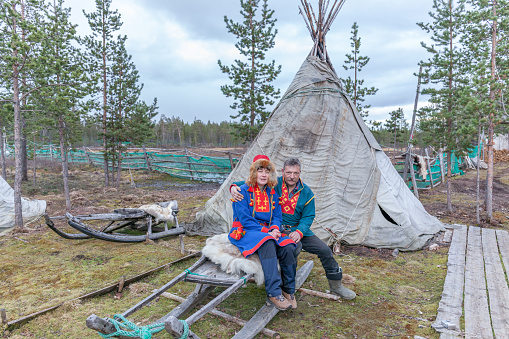 Lovozero, Russia - September 25, 2016: Man and woman, female saami, sami in national dress, saami village on the Kola Peninsula, Russia.