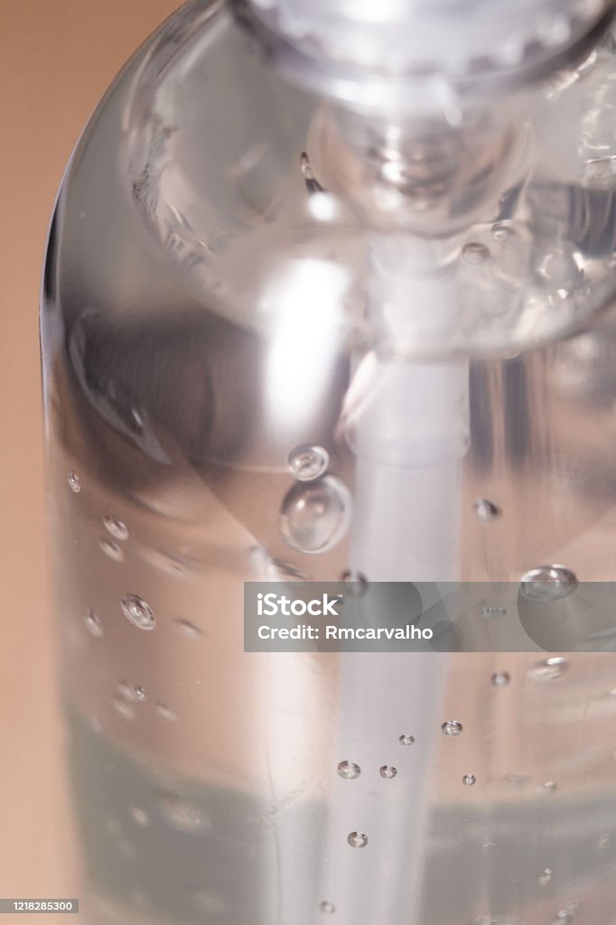 Hand sanitizer bootle ( Álcool em gel ) in close-up. Alcohol - Drink Stock Photo