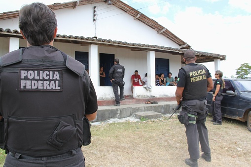 pau brasil, bahia / Brazil - april 21, 2012: Federal Police officers accompany a farm invaded by Pataxo Hahahae Indians in rural Pau Brazil.