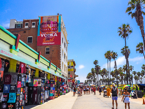 In July 2019, tourists were doing shopping in gift shops in Venice beach, in Los Angeles