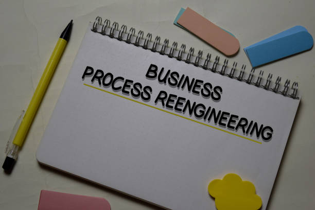 istock Business Process Reengineering write on a book isolated on office desk. 1218289322
