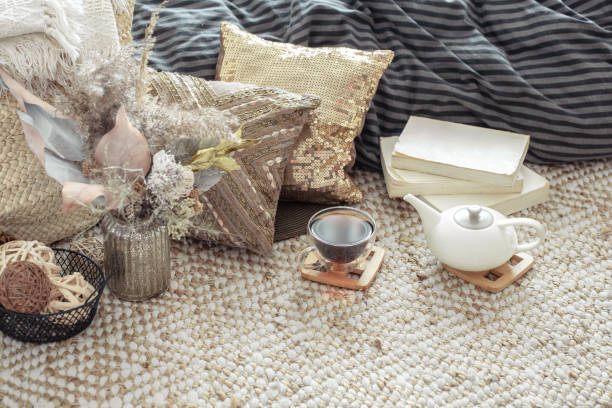 istock A teapot and a Cup of tea on the table in a cozy home interior. 1218290972