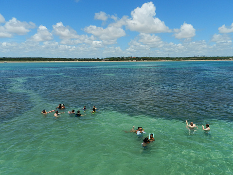 Joao Pessoa, Paraiba, Brazil - February 07, 2016: People bathe in the natural pools of Seixas, formed by huge coral banks that trap the sea water. It is a famous tourist attraction in the state of Paraíba.