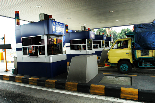 Sidoarjo, Indonesia - June 12, 2008: The entrance toll gate in the area of Waru, Sidoarjo,  is access to the Juanda International Airport in Surabaya, East Java, Indonesia