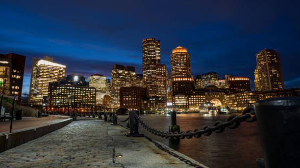 istock Boston Harbor and Financial District skyline at sunset in Boston 1218297583