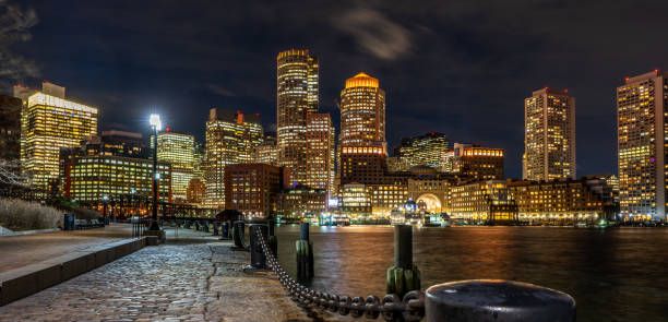 istock Boston Harbor and Financial District skyline at sunset in Boston 1218297591