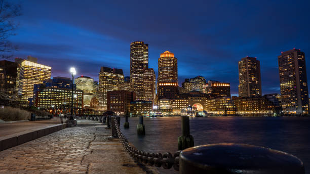 Boston Harbor and Financial District skyline at sunset in Boston