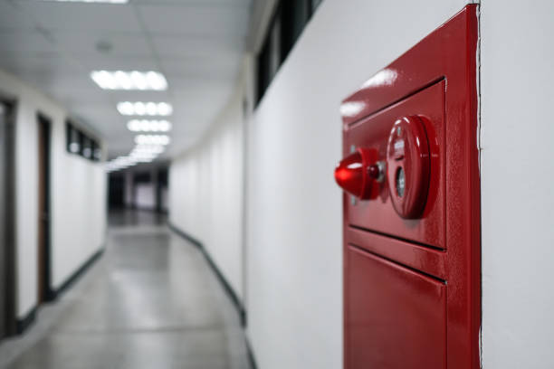 istock Alarm bells and warning lights for avoiding fire. Close up on fire hydrant, the background is in the corridor. 1218300475