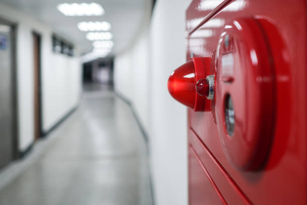 istock Alarm bells and warning lights for avoiding fire. Close up on fire hydrant, the background is in the corridor. 1218300482