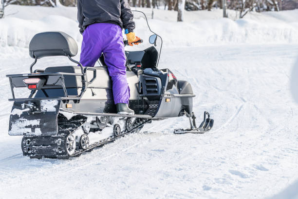 istock Driving a snowmobile in winter mountains 1218303551