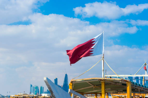 istock Qatar flag flying in the sky on a bright sunny day 1218306137
