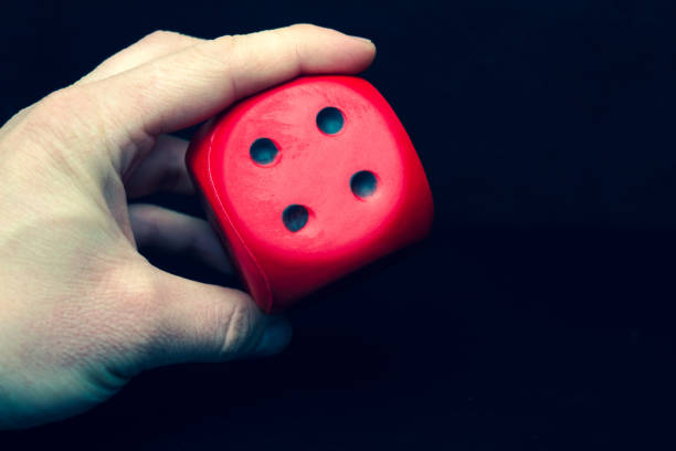 istock Big dice of red color in a hand 1218306248