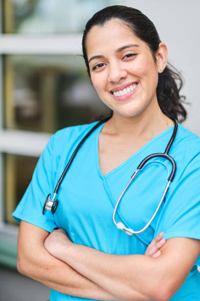 istock Young latin nurse with stethoscope arms crossed 1218307722