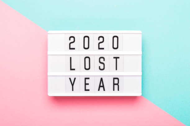 istock 2020 lost year concept. Lightboard with text 2020 lost year on paper geometric background 1218308371
