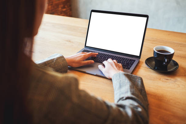 istock a woman using and typing on laptop computer with blank white desktop screen in cafe 1218309558