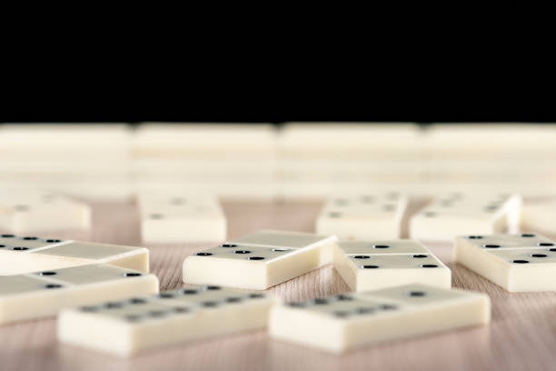 Playing dominoes on a wooden table