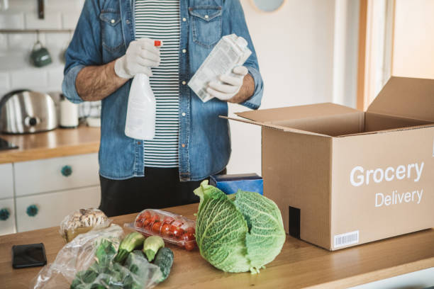 istock Disinfecting groceries in pandemic situation 1218314905