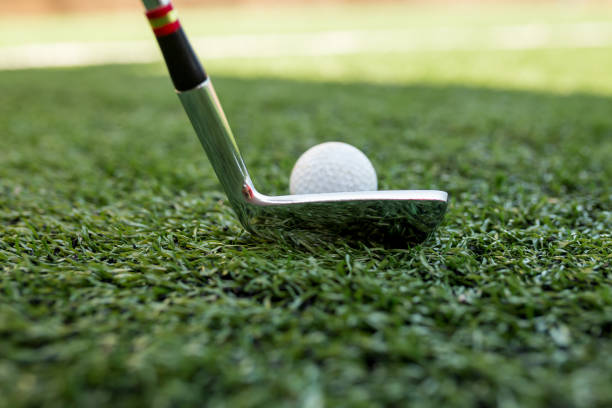 istock Golf stick and ball on green grass 1218315168
