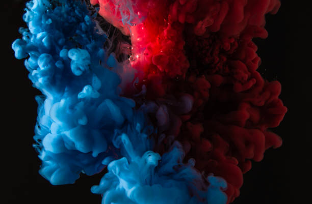 istock Explosion of paint mixing under water 1218317215
