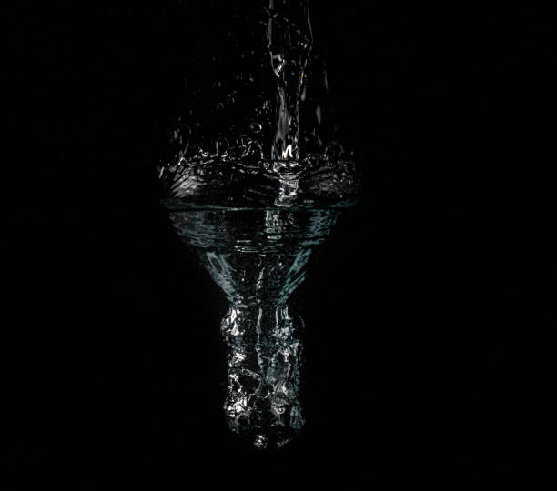 istock Strong splash of water on a black background 1218317421