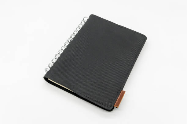 istock Black leather pocket notebook or sketchbook isolated on white background. 1218318147