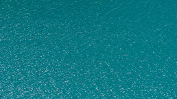 istock Smooth surface of lake with blue water, turquoise sea as background 1218320189